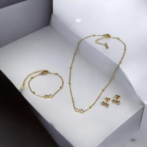Set collar, pulsera y aretes dorado acero inoxidable lazo