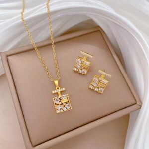 Conjunto dorado acero inoxidable piedra blanca