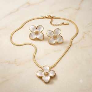 Conjunto dorado acero inoxidable flor blanca