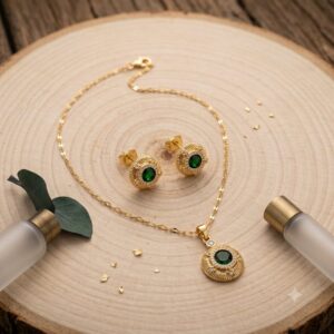 conjunto dorado acero inoxidable circular piedra verde